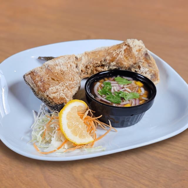 Fried Hamachi Kama with Thai Mango Salsa.